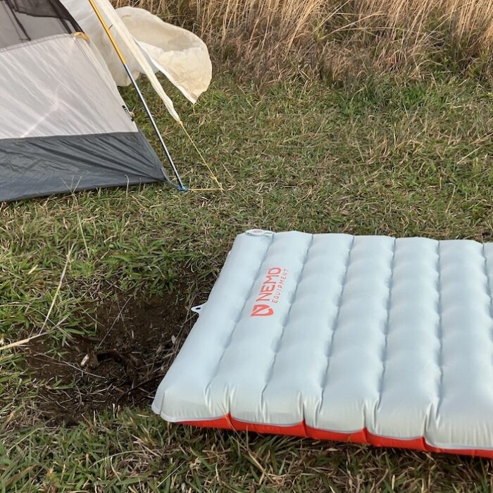 nemo tensor sleeping pad on the ground in front of a tent