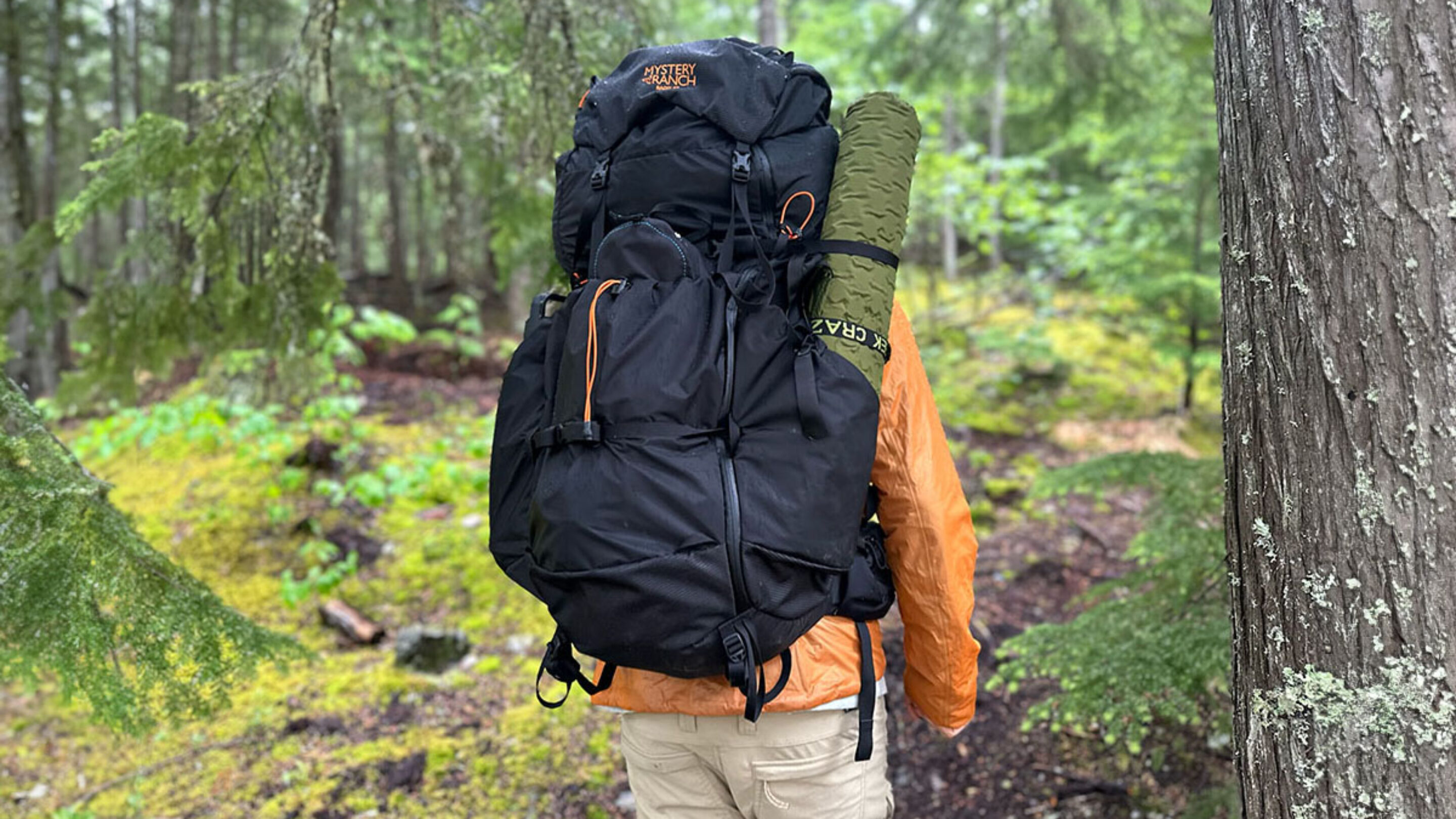 a hiker with the mystery ranch radix 57 backpack