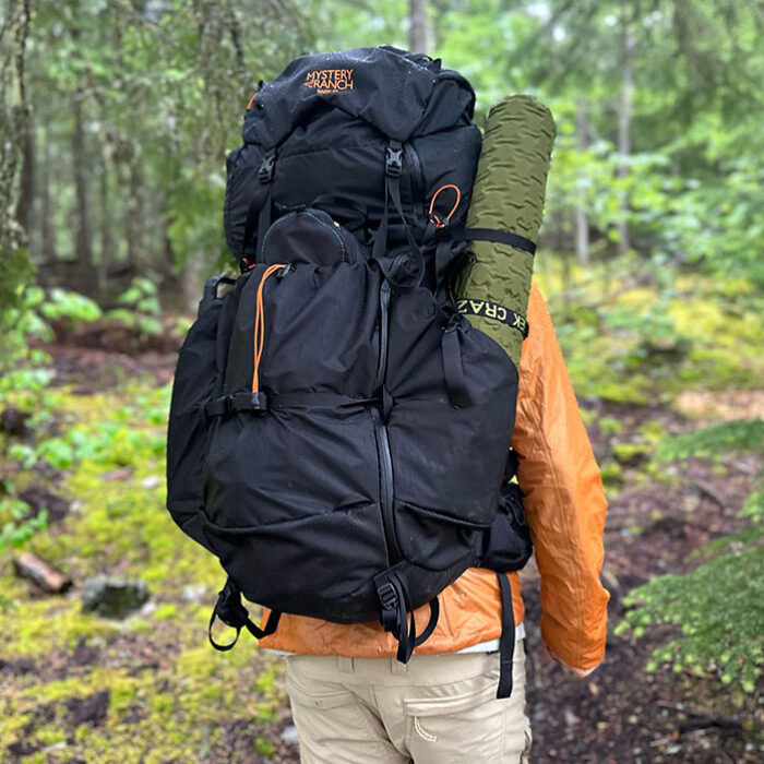 a hiker with the mystery ranch radix 57 backpack