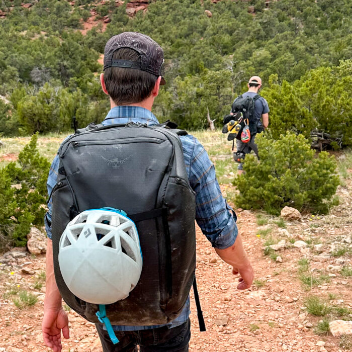 hiking to the crag with a travel backpack