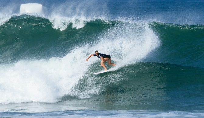 The Oi Rio Pro had similarly mediocre waves as years past but that didn't mean the performances dipped. Italo Ferreira negotiated the dreaded backwash with Main Character Energy, Caity Simmers and John Florence domination means fans are sure to question the format, Gabriela Bryan broke through and Ethan Ewing went "meh." With eight Championship Tour events down, and Fiji left, the Oi Rio Pro threw up almost as many questions as it did closeouts. Here we attempt to answer those burning queries. Florence and Simmers Domination Raises Finals Integrity Question (Again)  For those old enough to remember the first-past-the-post world titles, about now we would be trawling through the world title scenarios for the final event. “If John John loses in the quarters, Griffin fails to the make the final and a seagull shits on Jack Robinson in Round 2, then Italo can’t win at Pipe,” the World Surf League's Renato Hinkle would send out outlining the surfer's chances. The WSL Finals format has removed the complicated math....and the rewards for doing quite well. The runaway ratings leaders John John Florence and Caitlin Simmers look like the biggest possible losers in the new(ish) system. Simmers' win in Rio was her third CT of the year, giving her a 5,000-plus point lead going into Fiji. In the old system (though to be fair Caity was just 13 the last time that was in place) such domination would have been enough to have all but secured a world title. However, she will know that Carissa Moore also won three events last year, only to fall at the hurdle put in her place at Trestles. The year before, Steph Gilmore won her 8th World Title, despite finishing more than 10,000 ranking points behind Moore. You wonder why she bailed this year. The integrity of the WSL Format diminishes when there’s a dominant surfer throughout the season.  John John Florence too would have claimed his world title in Brazil under the old system. His 10,000-point lead would have been insurmountable. And yet his remarkable consistency (he’s made the final in four of the eight events) will count for now, when he gets to Trestles. And yes, the Finals' format does provide solid weighting based on final positioning, but try telling that to Carissa Moore. It will always split surf fans into two camps, and the move to Fiji next year will undoubtedly boost its popularity. However, in the cases where a surfer, or surfers, have dominated their opponents all year, it brings its integrity issues into even sharper relief.  Italo Ferreira’s Main Character Energy Italo, though, won’t give a shit. The WSL Finals have given him another shot at a world title, and with his confidence sky high, like his ranking, he's rocketed into contention. He was the last men’s surfer to win a world title on points when he dramatically sealed a win at Pipeline in 2019. Since the WSL Finals were introduced he’s finished as runner-up and third, before last year, which was his worst on tour since 2018.  That form continued in 2024. Was it the disappointment of missing the Olympics, or a general air of distraction? At one stage he was in real danger of missing the cut. The intensity of Tahiti changed his game, and Rio provided the crowds, and the ramps, that he thrives on. Unlike all the other contenders, the Olympics won’t provide a distraction, and he now has six weeks off to focus on Cloudbreak. He has competed in Fiji in 2015 and 2016, suffering early-round losses both times. But Italo is a different person and surfer from earlier this year, let alone eight years ago. With a single focus and now a clear path to a world title, his Main Character Energy has ignited the race.   Race For Fifth: Ethan Goes Meh It’s not so much that Ethan Ewing has tailed off at the wrong time. It's more that he's never really taken off at all in 2024. Having fought back from a spinal injury to make the Finals in 2023, it looked like the most technically proficient and stylish surfer on tour was ready for a huge step up. And yet, it's been largely a meh type of year. His quarterfinal loss to Finals rival Jordy Smith was fairly representative. Poor wave selection and a lack of aggression cost him in a tight, low-scoring heat. He's only made it past the Quarters once all year (a final in Portugal), and his three ninths and three fifths aren't screaming world title form. With Yago Dora making back-to-back finals now breathing down his neck in sixth, and Smith and Medina within striking distance, it all comes down to Cloudbreak for Ewing. An average result won’t cut it.  A Straight Shoot Out Between Bryan and Defay? In the women’s, Gabriela Bryan has been the breakout star of 2024. The Hawaiian's maiden CT win in Margaret River secured not only her place on tour but the confidence to launch a serious attack on a Finals place. Now 22, and in her third year on the CT, the experience is starting to show. Working with Richard “Dog” Marsh, and surfing with his stable of Ryan Callinan and Conor O’Leary has benefited her, too. Her post-cut consistency has seen her grab a slender lead over the veteran Johanne Defay and it looks like it could be a straight shoot-out between the pair for a spot at Trestles. Defay has won in Fiji before, and her backhand is lethal, so she should be considered a favorite. Yet the underrated Hawaiian took out Defay in Rio in Round 4, and is now believing that she belongs at this level. The Bryan-Defay battle could be one of the more compelling storylines of the Fiji event. 