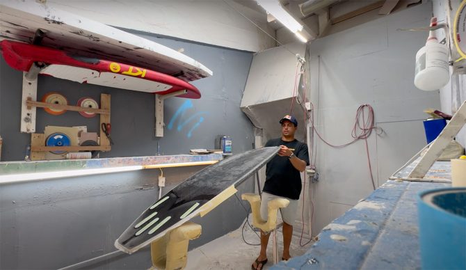Kai Lenny shaping surfboard
