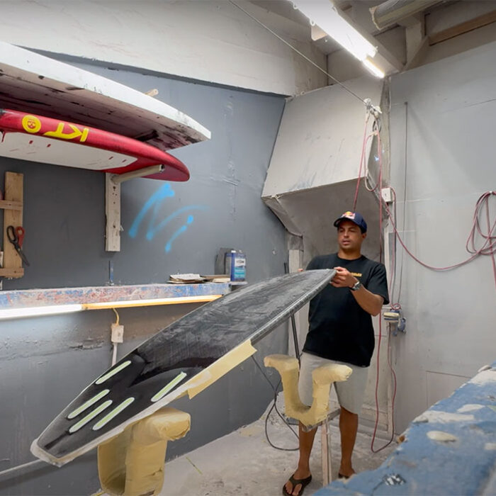 Kai Lenny shaping surfboard