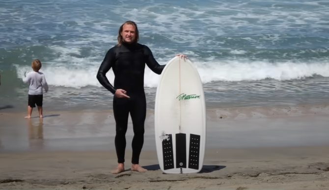 Ben Gravy poses next to what amounts to a lunch tray with fins. Photo: Ben Gravy // YouTube