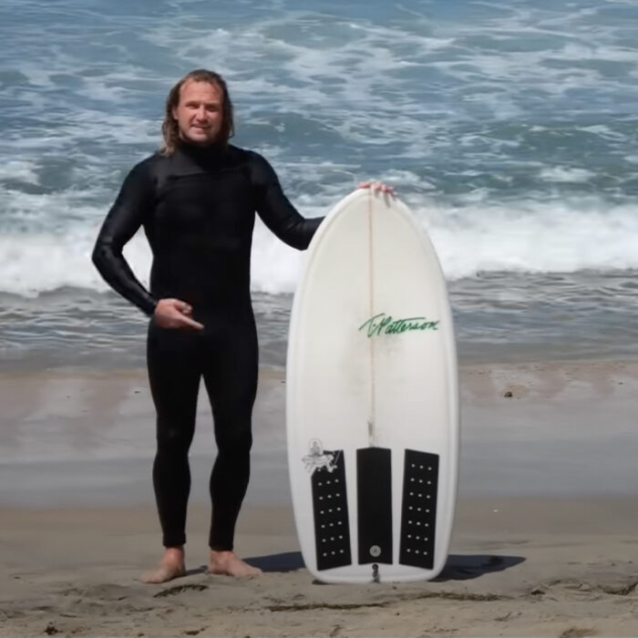 Ben Gravy poses next to what amounts to a lunch tray with fins. Photo: Ben Gravy // YouTube