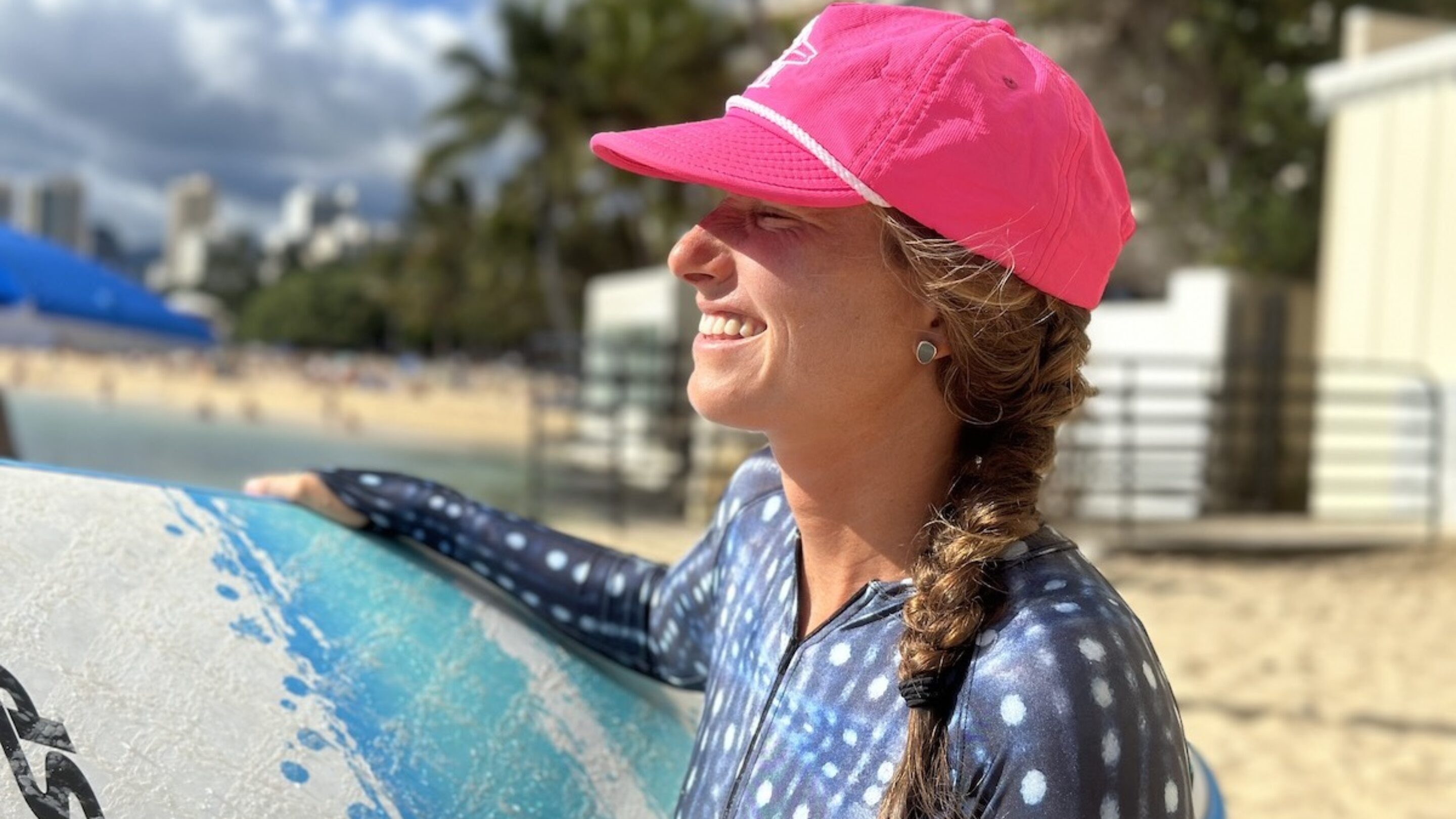 a woman wearing a surf hat