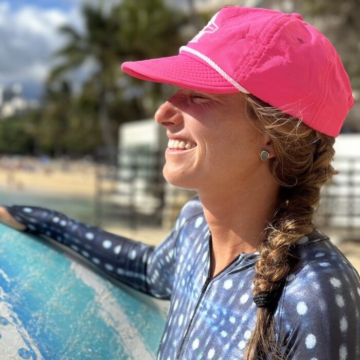 a woman wearing a surf hat