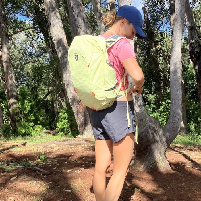 a woman wearing a hiking backpack