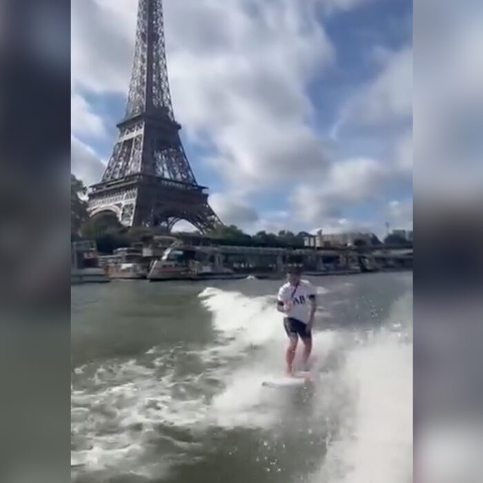 Kauli Vaast braves the famously polluted waters of the Seine to celebrate winning Olympic gold. Photo: Surfing France // Instagram