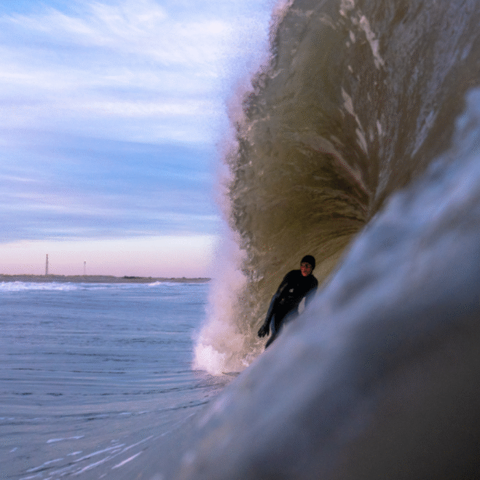 Kai Wescott gets barreled at the Cape Hatteras Lighthouse. Photo: Cody Hammer