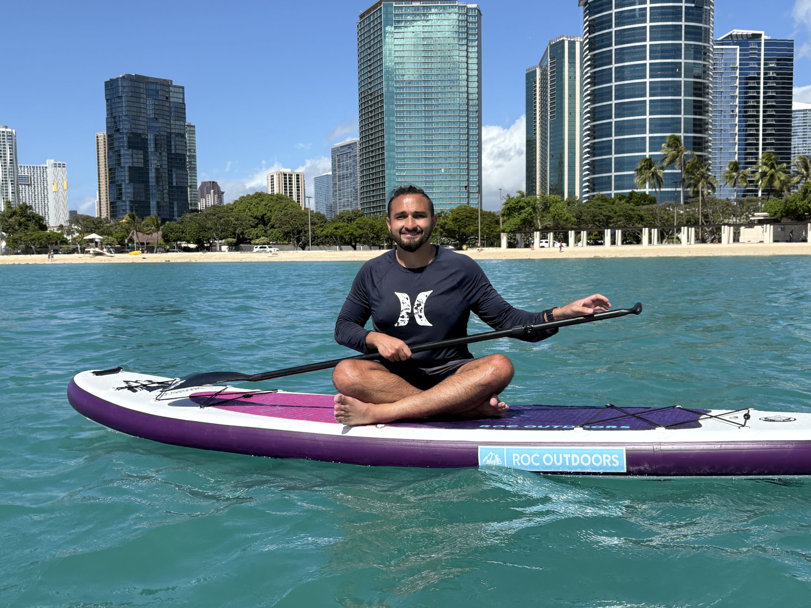 a man on a paddle board 
