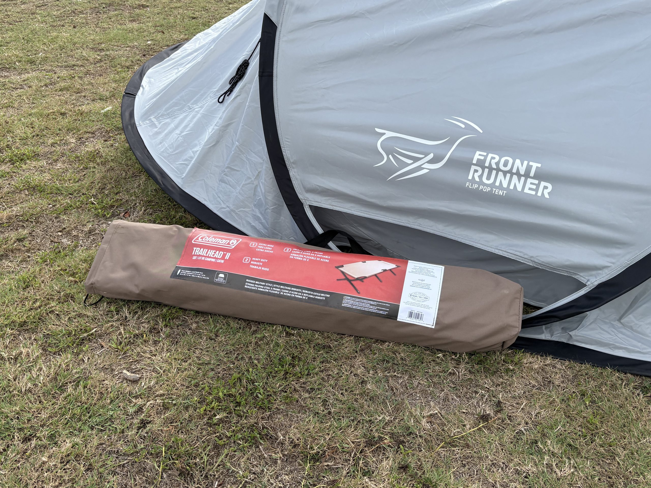 a camping cot packed up