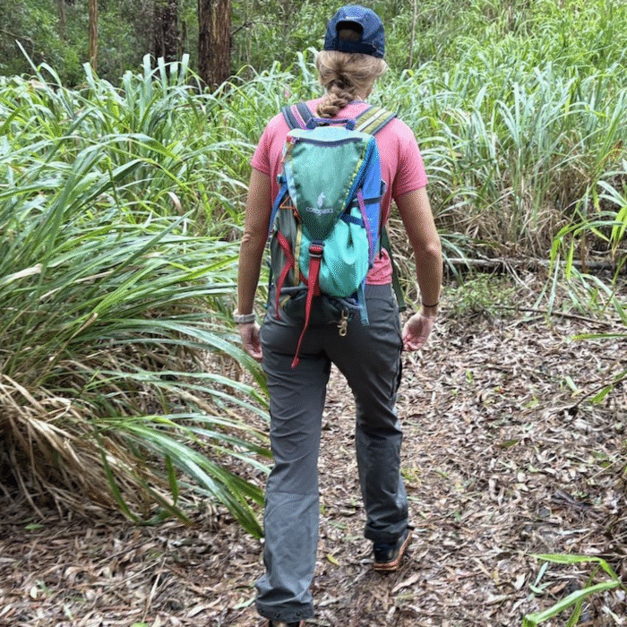 a woman hiking in hiking pants