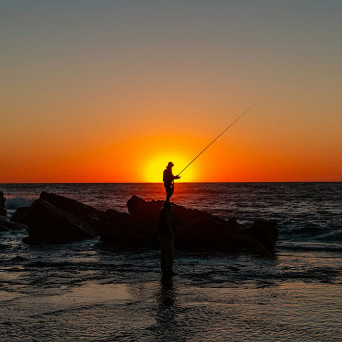 fisherman on rock