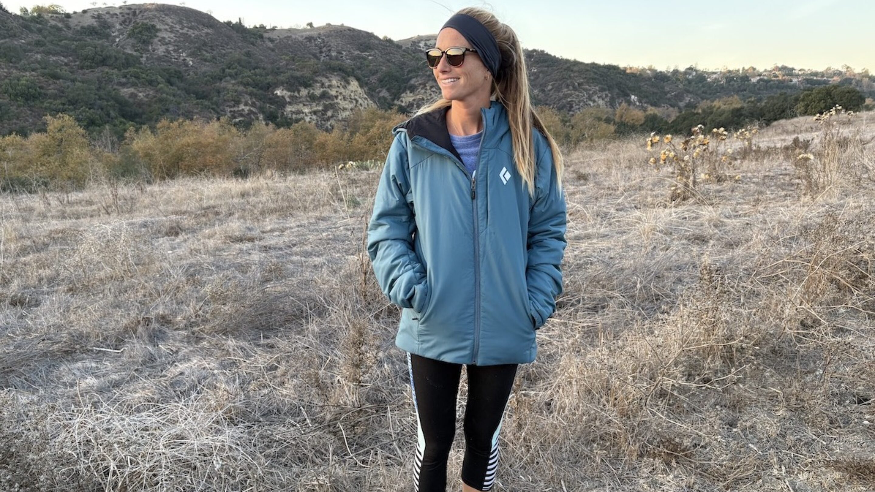 a woman in a first light black diamond puffer