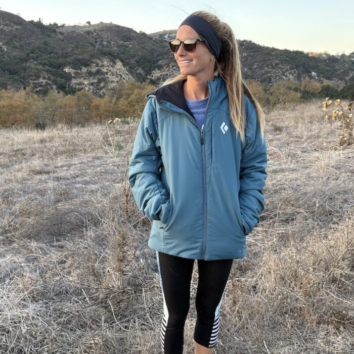 a woman in a first light black diamond puffer