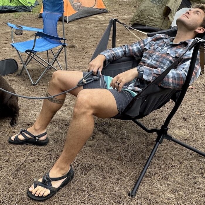 a man in the Nemo Stargazer camping chair