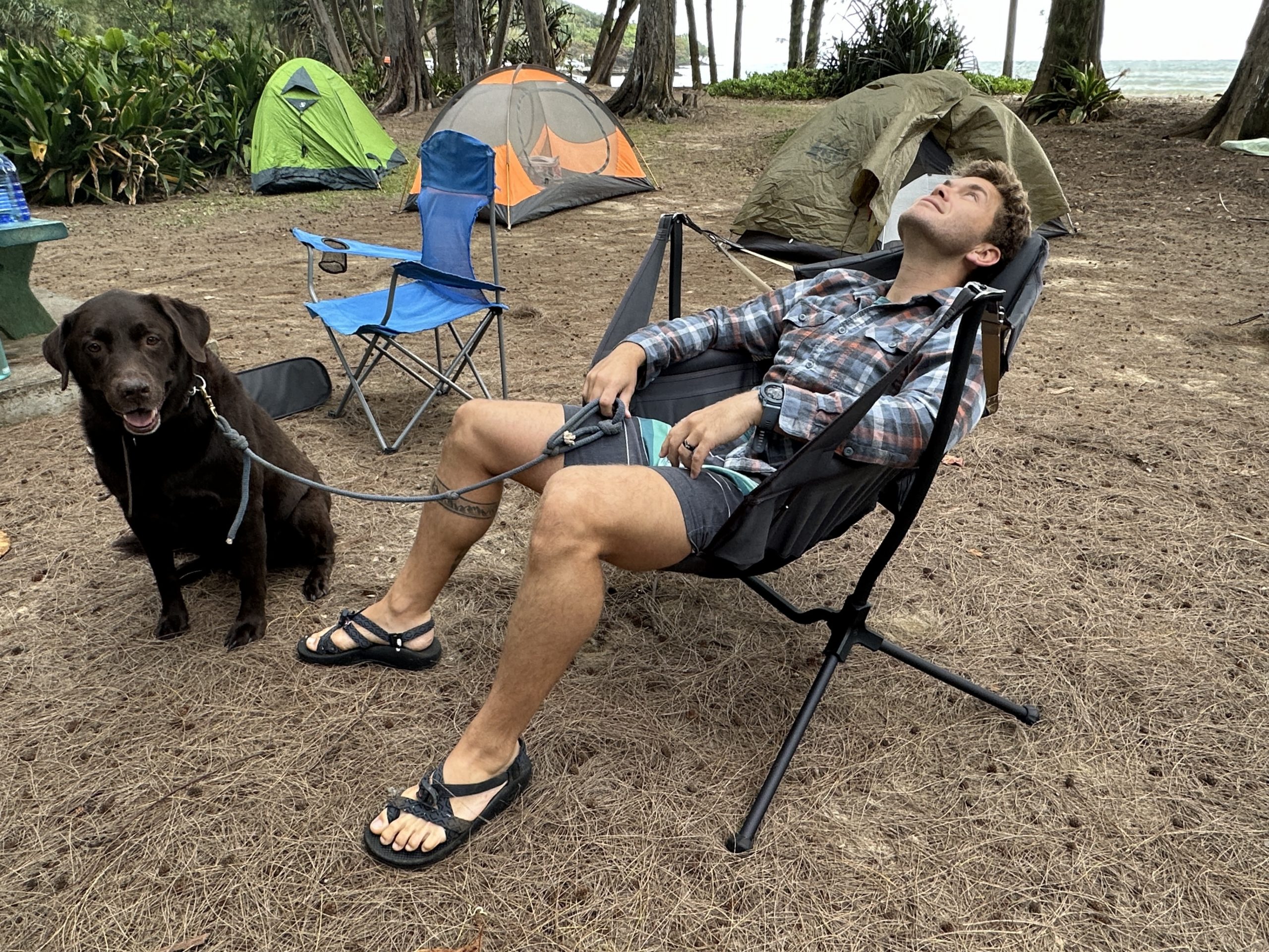 s man sitting in a Nemo Stargazer camping chair