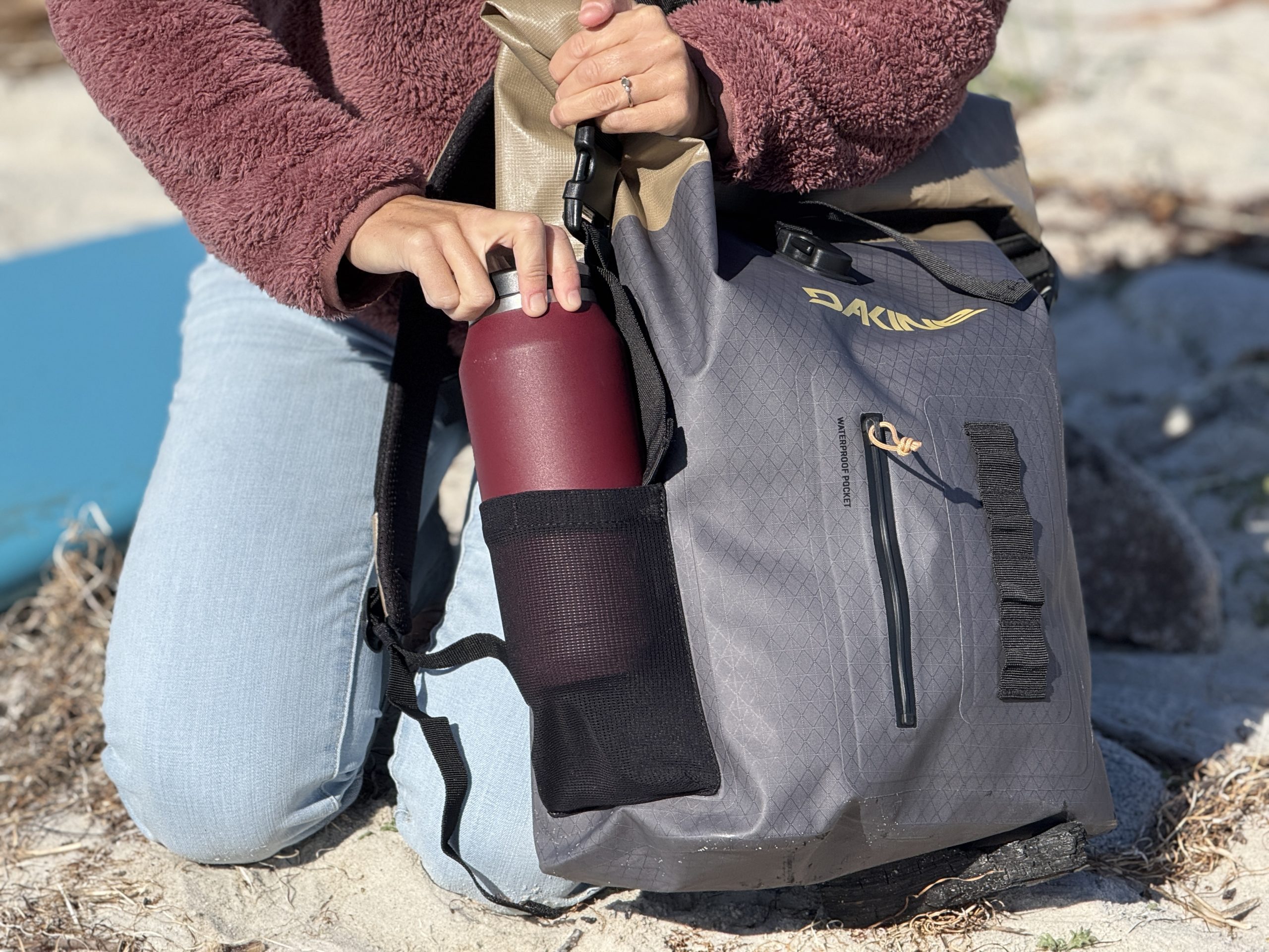 water bottle holder on a surf backpack
