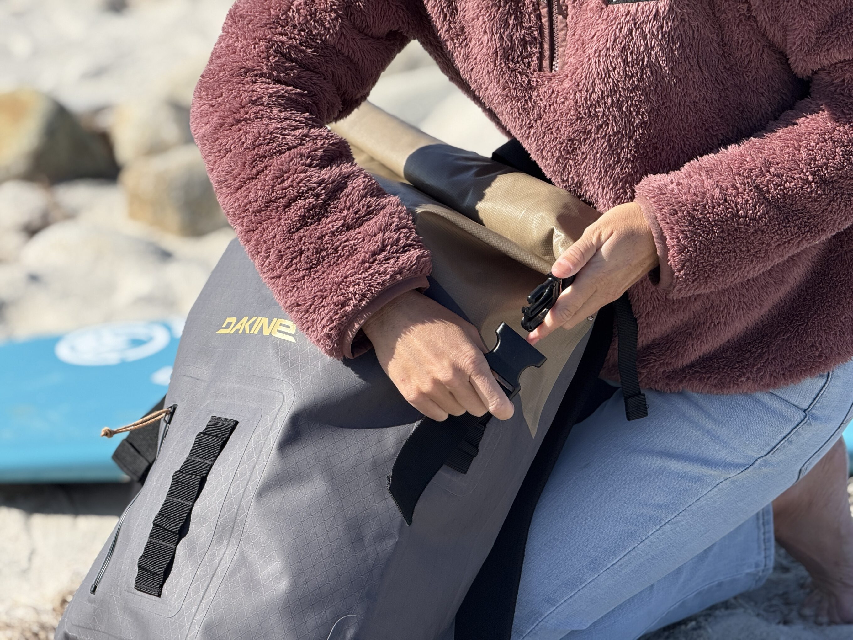 a buckle on a surf backpack