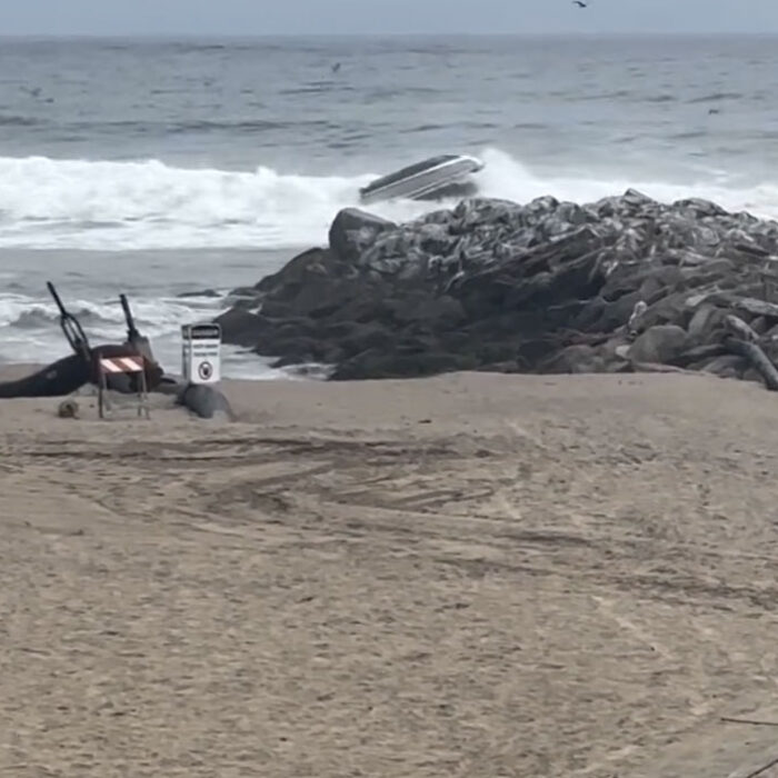 Boat flips at Santa Cruz Harbor