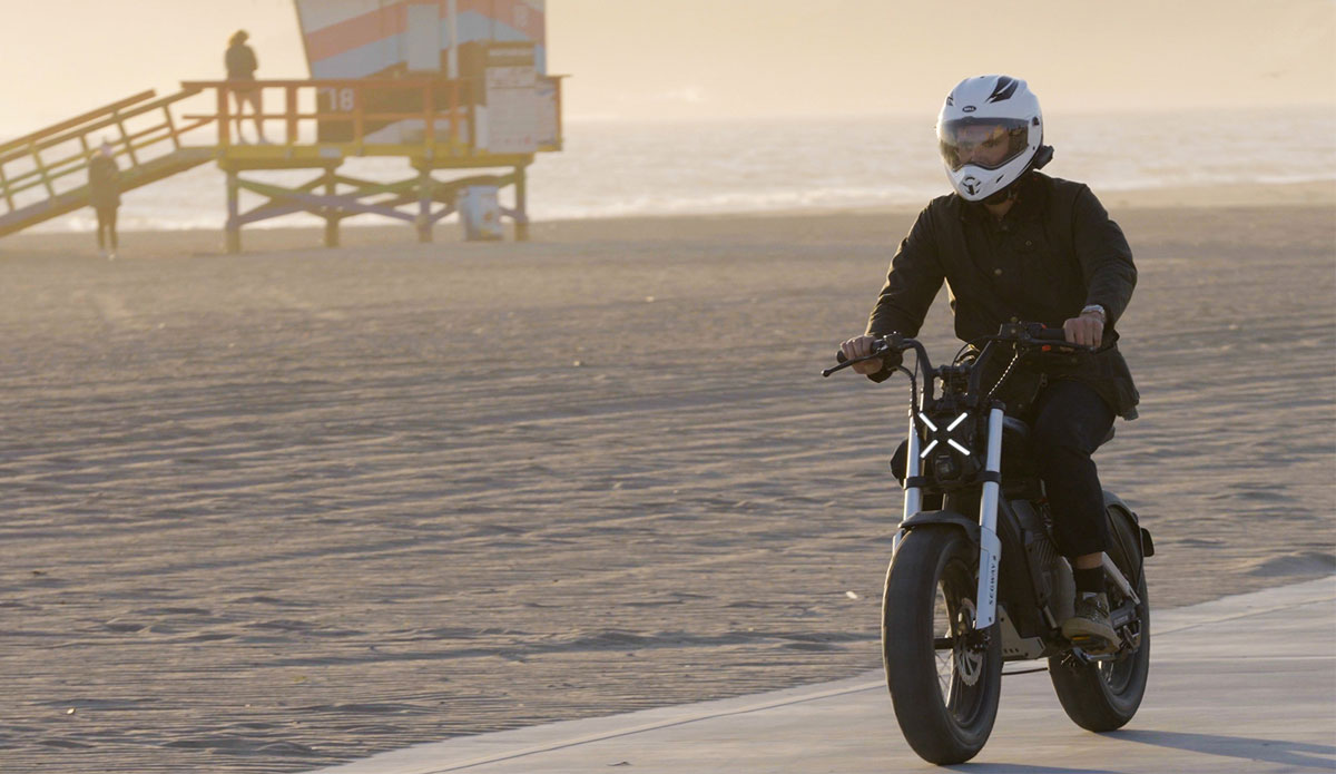 rider on segway xyber e-bike beach sunrise