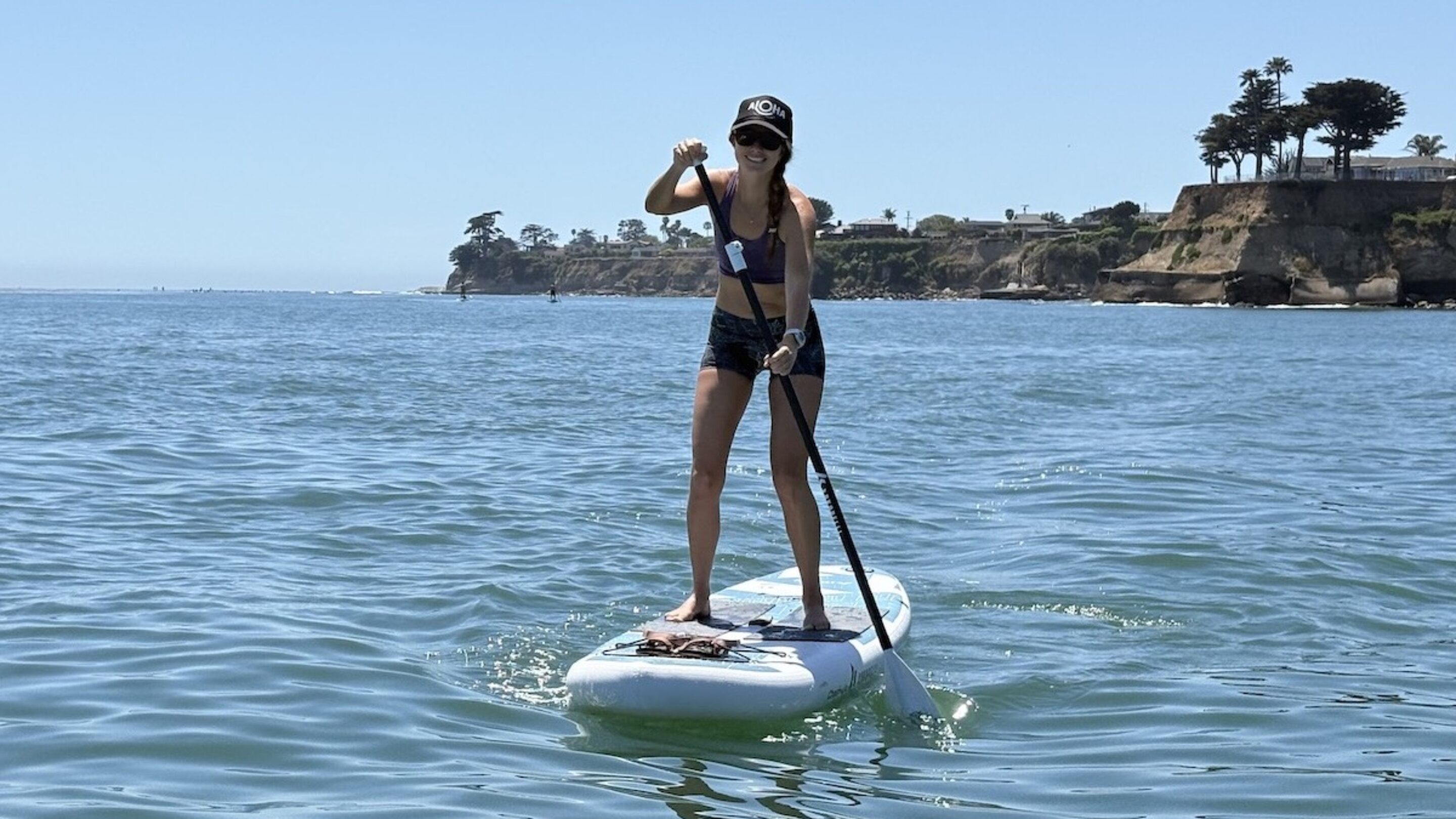 a woman stand up paddling on a Chasm-Lite
