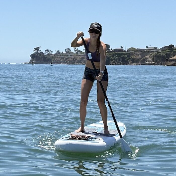 a woman stand up paddling on a Chasm-Lite