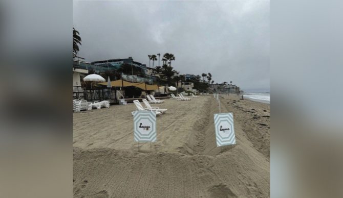 Hotel Laguna has maintained a sand berm and posted signs, in an alleged attempt to discourage public beach access. Photo California Coastal Commission