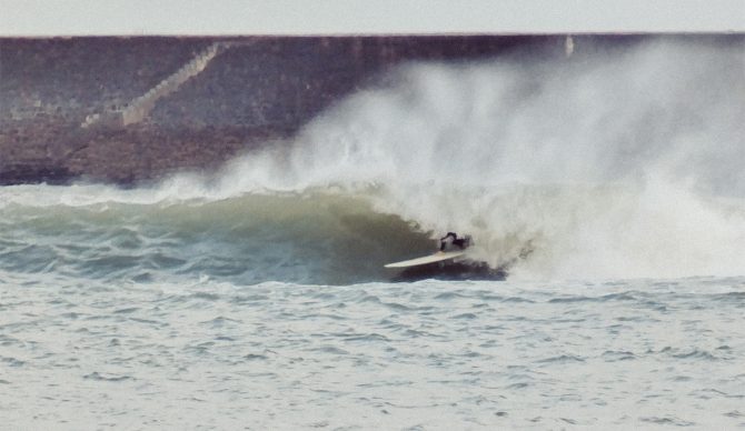 The grainy textures and blurred motion found throughout Stroud's work oppose the crisp, clean aesthetic of commercial surf photography. Photo: J.D. Stroud