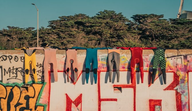 Wetsuit lineup at ocean beach