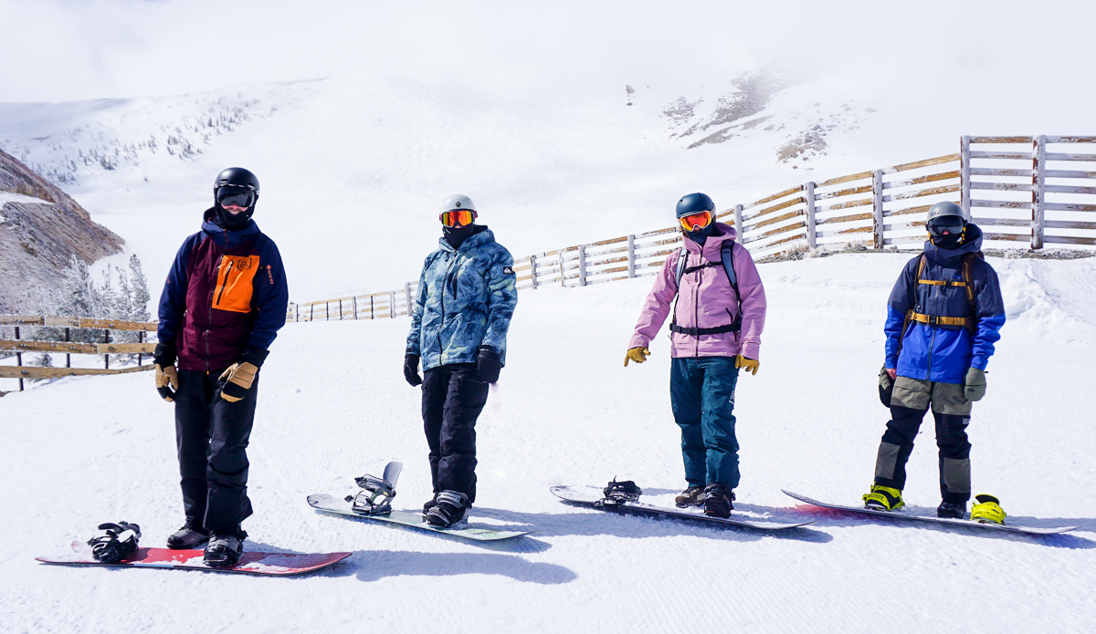 four snowboarders