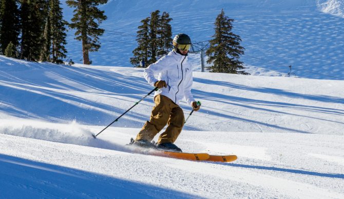skiing in the flylow baker bibs and HH Alpha 4.0