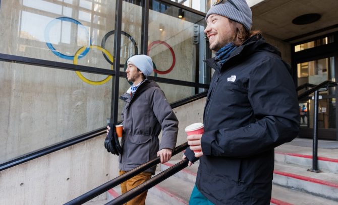 Will and Nate walking past the Olympic Rings