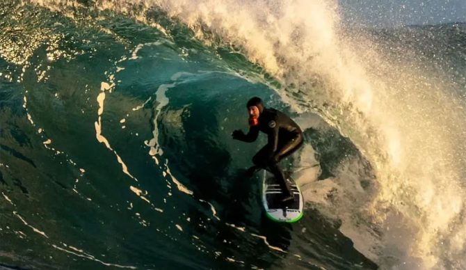 Ian Battrick surfing in a barrel