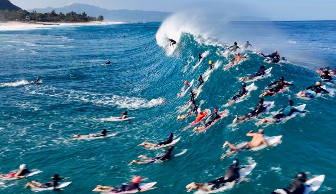 Surfers with Jamie O'Brien in the lineup at Pipeline
