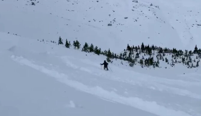 A skier attempts to ski out of the avalanche in Harvey Pass. Photo: Avalanche Canada