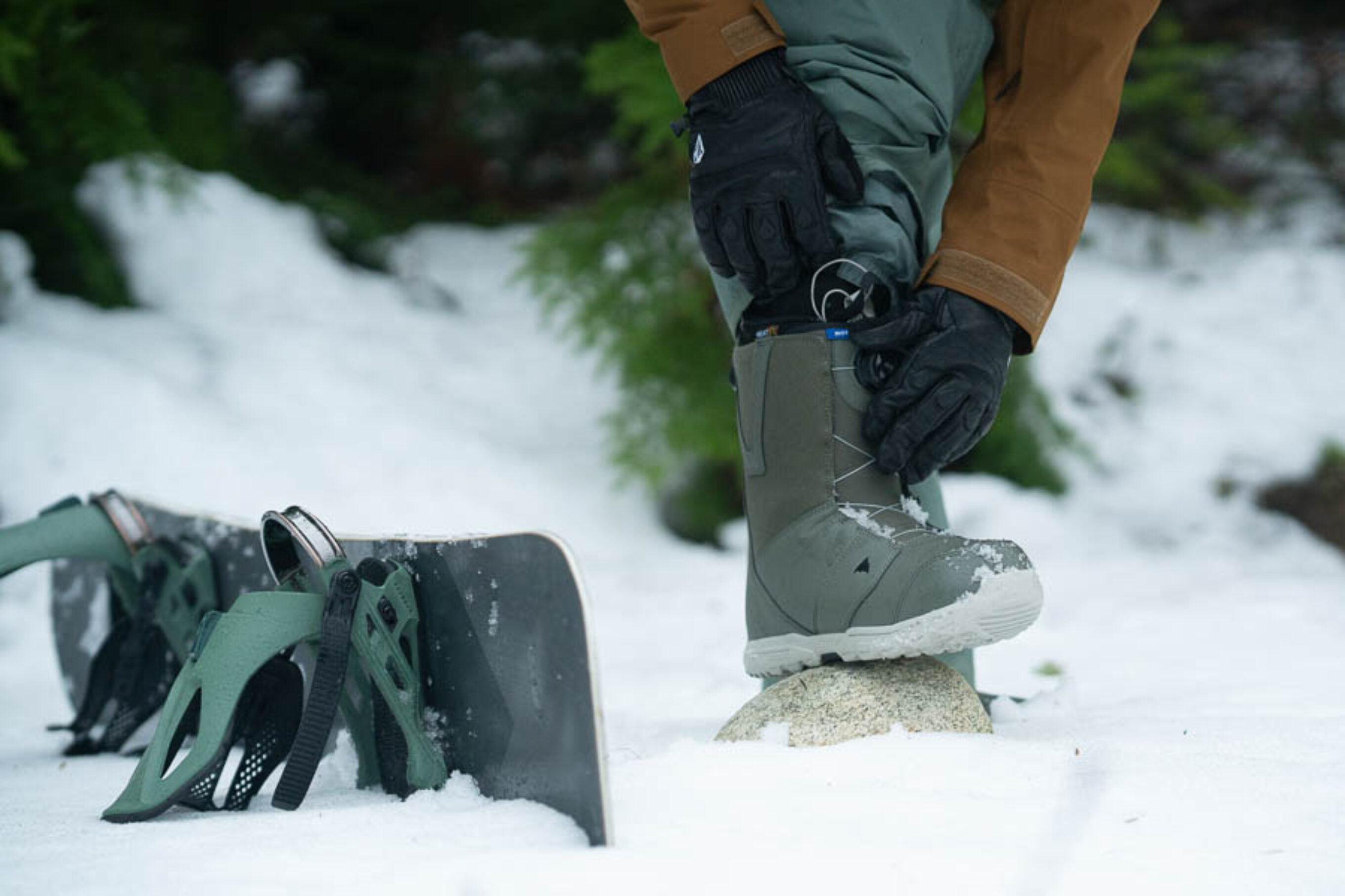 snowy scene with snowboard and boots