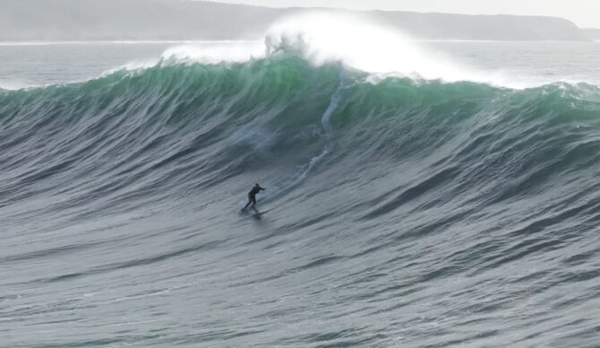 Lucas 'Chumbo' Chianca taking run at a wall of water. Photo: Tim Bonython // YouTube
