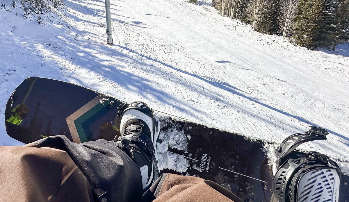 view of snowboard boots from ski lift