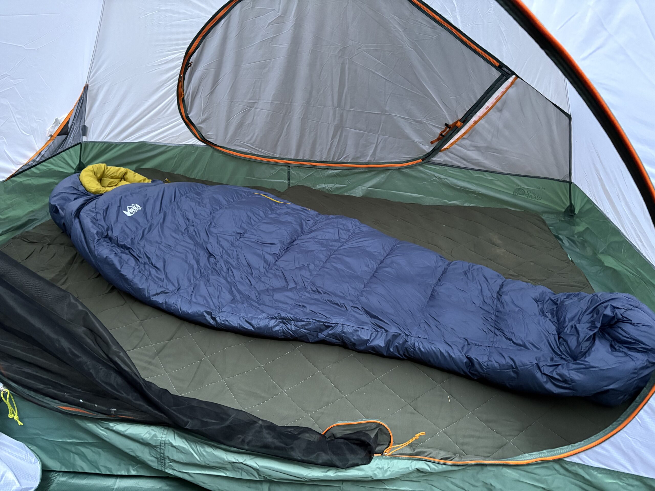 a sleeping bag in a tent