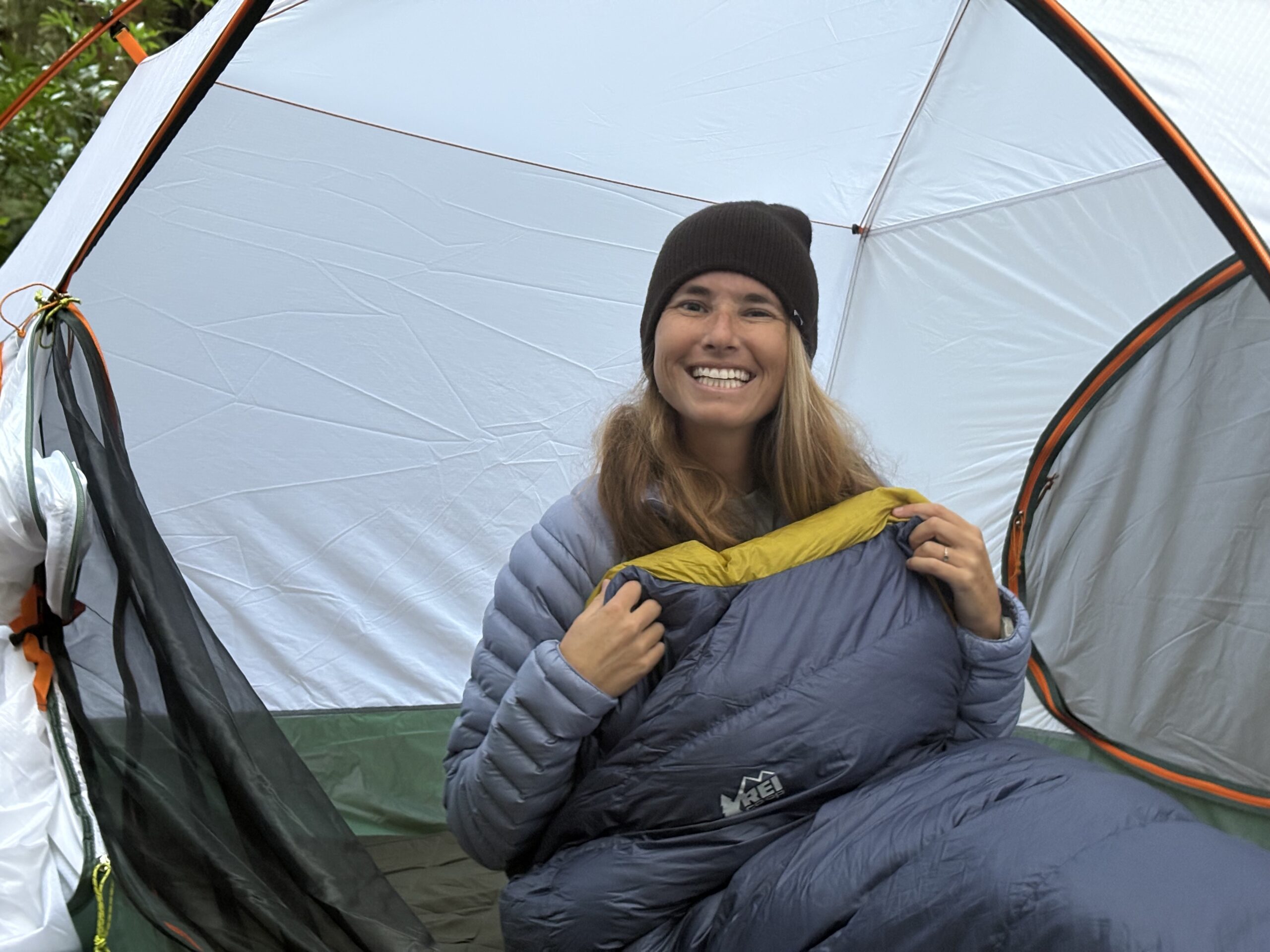 a woman in a sleeping bag