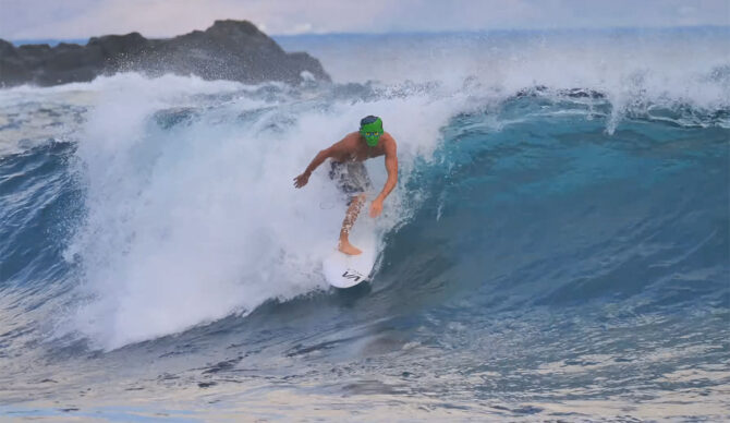 Clay Marzo surfing in a Frankenstein mask