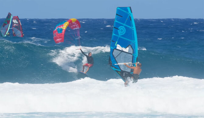 Kai Lenny surfing a longboard with a parawing at Hookipa