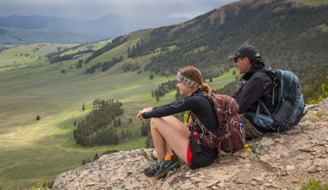 Foreign visitors sitting at Yellowstone National Park
