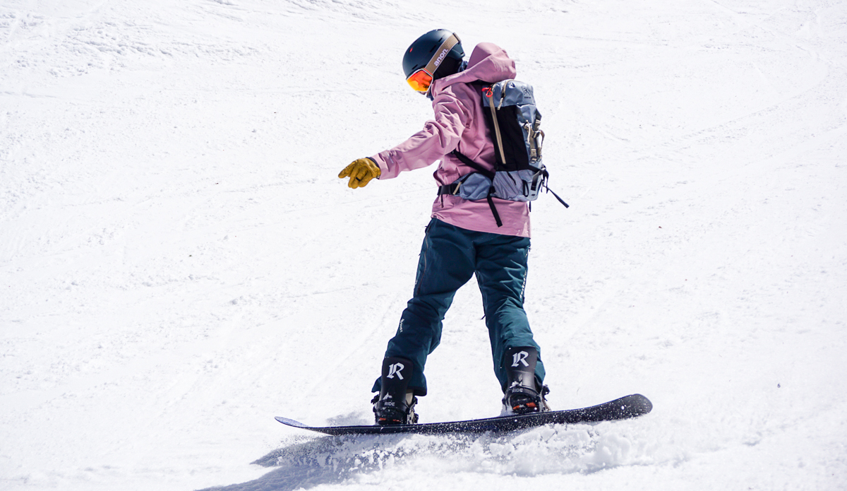 man landing on snowboard