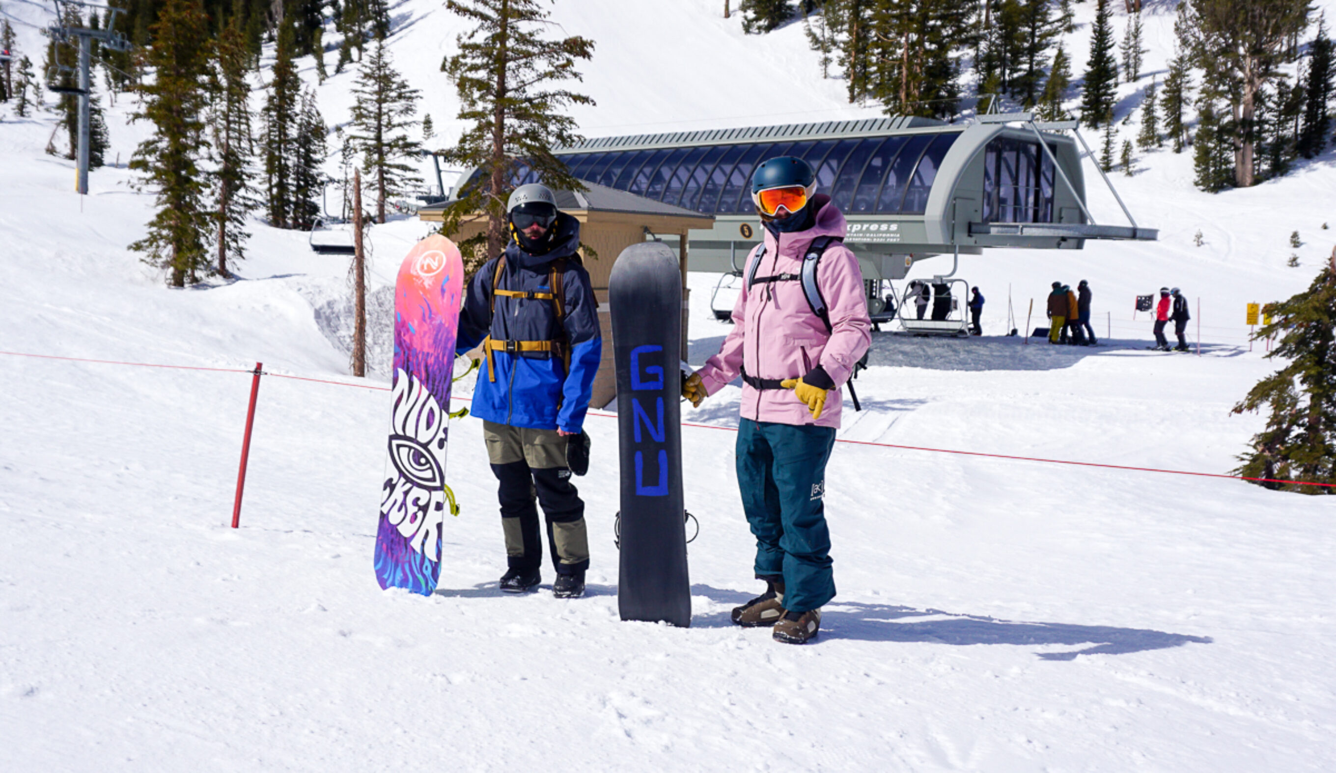 two men with two snowboards