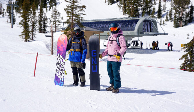 two men with two snowboards