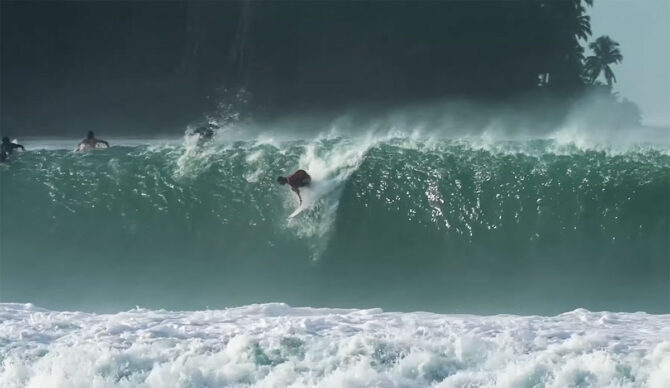 Matt Bromley paddling into a wave