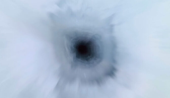 Camera dropping down a borehole in the Doomsday Glacier